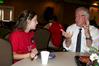 Jim Veneman, assistant professor of communication arts, talks with incoming freshmen during the Dinner with your Department event. - Photo by Deanna Santangelo