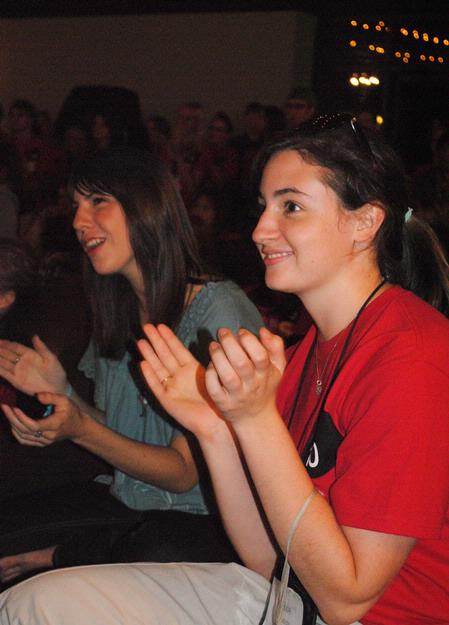 Abby Winters and Ahnna Reyes enjoy the fun acts in the new student Open Mic Night held at Barefoots Joe. 
