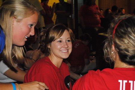 Ashley Smith, new student, visits with friends at the new student Open Mic Night at Barefoots Joe. 