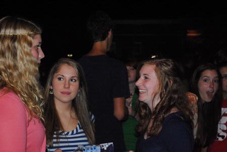 Brittney Banks, Alison Holcomb, and Taylor Jowers, all new students, get to know each other at the Howdy Party.