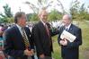 Jimmy Harris, mayor of Madison county, Jerry Gist, mayor of the city of Jackson, and David S. Dockery, president of Union University, talk outside of Providence Hall during the dedication ceremony.  - Photo by Morris Abernathy
