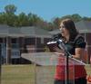Kristen Wells, assistant resident director, reads scripture at the dedication of the Hope Residence Complex. - Photo by Morris Abernathy
