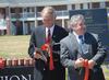 Jerry Gist, mayor of Jackson, and Frank Wagster of TLM & Associates laugh together after the ribbon cutting in from of the Hope Residence Complex.  - Photo by Morris Abernathy