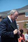 President David S. Dockery bows his head as Rod Parker leads the benediction after the dedication of the Hope Residence Complex. - Photo by Morris Abernathy