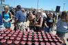 Student pick up their commemorative cups after the dedication of the Hope Residence Complex.  - Photo by Morris Abernathy