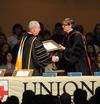 President David S. Dockery presents Greg Thornbury, vice president for spiritual life and dean of the school of theology & missions, with a plaque in honor of his new role at the university. - Photo by Morris Abernathy