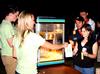 Becka Johnson, junior nursing major, helps her fellow SAC members hand out popcorn at the first Movie on the Lawn of the semester.  - Photo by Ebbie Davis