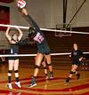 Marcela Madeira spikes the ball over the net during a game against Martin Methodist, which the Lady Bulldogs won 3-1 - Photo by Deanna Santangelo