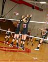 Ana Sims and Caroline Robbins jump to block the ball against Martin Methodist. The Lady Bulldogs won 3-1. - Photo by Deanna Santangelo