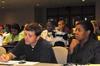 Greg Ginn and Veronica Morrow, both in the master of social work program, listen during the Social Justice Symposium.  - Photo by Victoria Stargel