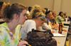 Katie Reynolds, freshman elementary education major, listens as Elizabeth Clack shares movie stories of reconciliation and healing in South Africa. Clack spoke during the Social Justice Symposium. - Photo by Victoria Stargel