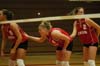 Jennie Glassey (8), Lindsay Stahlberg (4), and Erin Bayne (2), all Lady Bulldog seniors, await the next serve. - Photo by Steven Aldridge