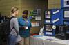 Amy White, senior nursing major, talks with a representative from Star Center in Jackson during GO Week at Union.  - Photo by Ebbie Davis