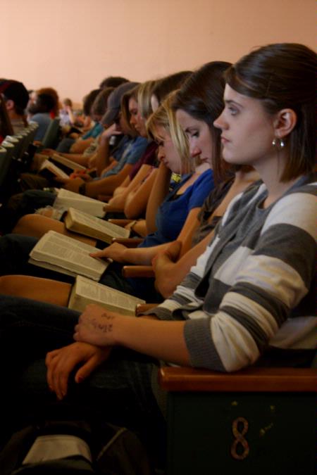 Students follow along in their Bibles during GO Week chapel lead by J.D. Greear, lead pastor of The Summit Church in Durham, NC.