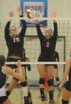 Shelby Swink (10) and Heather Lieberman (3). - Photo by Morris Abernathy