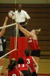 Lindsay Stahlberg (4) attempts to sneak the ball past the blocker.  Nicole Garber (3), Gladys Wandera (11), and Jennie Glassey (9) look on. - Photo by Steven Aldridge