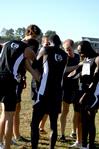 The Bulldog cross country team huddles together for prayer before a race.  - Photo by Deanna Santangelo