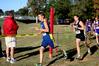 Joel Wellum, senior political science major, rounds a corner in a cross country race.  - Photo by Deanna Santangelo
