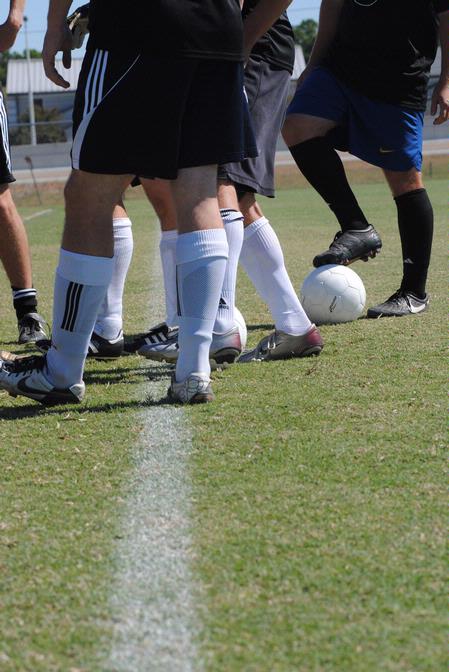 Union Soccer Alumni huddle up before facing the Union Bulldogs current JV team during family weekend. 