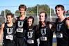 The men's cross country team members stand together after finishing a meet.  - Photo by Deanna Santangelo