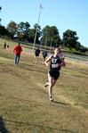Carrie Moore, senior biology major, runs in a cross country meet.  - Photo by Deanna Santangelo