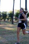 Hannah Clardy, senior Biblical Studies major, runs across campus during a women's cross country meet.  - Photo by Deanna Santangelo