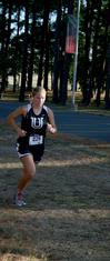 Hannah Clardy, senior Biblical studies major, runs in a meet on Union's campus.  - Photo by Deanna Santangelo