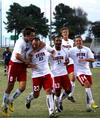 The Bulldogs celebrate a goal by Dejan Kostic (second from left) in a game against Mid-Continent University.  - Photo by Ebbie Davis