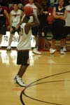 Senior guard Zach Wiggs takes a shot during the Hot Shot competition as his teammates watch. - Photo by Courtney Ross