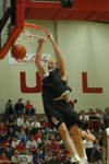 Junior forward Michael Palmer dunks during the Bulldog Madness warm-up session. - Photo by Courtney Ross