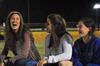 Ashlin Woodard, junior special education major, Libby Parks, junior nursing major, and Katie Cooper, sophomore dms major, cheer on their friends at an intramural flag football game.  - Photo by Victoria Stargel