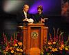 David S. Dockery, president of Union University, presents Laura Bush, former first lady of the United States, with gifts bearing significance to Union. Dockery presented a study Bible, to which several Union faculty contributed, and a Lady Bulldogs baseball cap, representing Union's national title in women's basketball. - Photo by Victoria Stargel