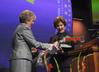 Lanese Dockery, first lady of Union University, thanks Laura Bush, former first lady of the United States, for speaking at the 13th annual Scholarship Banquet and presents her with roses.  - Photo by Morris Abernathy
