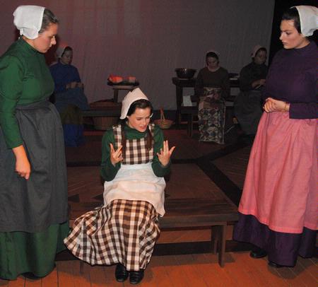 Megan Meyerhoff, Sarah Love, and Hallie Hardin perform as Shaker women in the Fall play, As It Is In Heaven, presented in the W.D. Powell Theatre. 