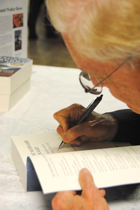 Dr. Daniel Walker Howe, Pulitzer Prize-winning author, signs a copy of his book, <em>What Hath God Wrought</em>, after lecturing for the Carls-Schwerdfeger History Lecture Series.