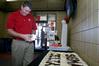 Steven Aldridge, director of sports information, sets up the table for PEWS at Career U. - Photo by Deanna Santangelo