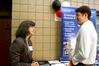 Andrew Moore, junior computer science major, speaks with Kay Moore, representative from the IRS, at Career U. - Photo by Deanna Santangelo
