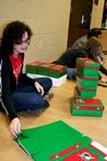 Amelia Seaton, freshman nursing major, helps assemble boxes for Operation Christmas Child during Campus and Community Day. - Photo by Deanna Santangelo