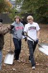 Freshmen Ben Erickson, psychology major, and Trevor Avery, biology major, volunteer their time at Liberty Garden Park for Campus and Community Day. - Photo by Ebbie Davis