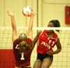 Gladys Wandera (11) elevates for one of her game high 23 kills during a loss to Lee. - Photo by Steven Aldridge