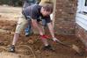 History students help in the restoration of an historic home in Casey Jones Village as part of Campus and Community Day. The historic home, called the Neil House, was relocated from Trenton, Tn. - Photo by Kristi McMurry