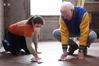 Caitlin Roach, junior history major, works with Stephen Carls, university professor of history and department chair, to clean the floor of the Neil House, the historic home being restored at Casey Jones Village. The history department helped with the restoration as part of Campus and Community Day. - Photo by Kristi McMurry