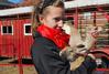 Emily Logan, senior music performance major, holds a rabbit at the petting zoo that was a part of the Homecoming festivities on the Great Lawn. - Photo by Abigail Harris
