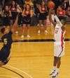 Union Bulldog Antoine Hall shoots over the head of his Truett-McConnell College opponent in the homecoming game. The Bulldogs emerged with a victory of 79-69. - Photo by Victoria Stargel