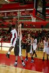 Lavanda Ross jumps over her University of St. Francis opponents for a shot in the homecoming game. The Lady Bulldogs won the game 83-57.  - Photo by Deanna Santangelo