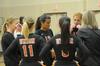 Union volleyball players take a timeout and get motivation from coach Kelly Elliot, assistant professor of physical education. - Photo by Morris Abernathy