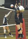 Anna Sims and Caroline Robbins go up for the block. - Photo by Morris Abernathy