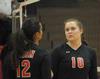 Shelby Swink (10) talks to Marcela Madeira between plays.  - Photo by Morris Abernathy
