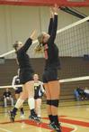 Shelby Swink and Emmie Mososki go up for a block. - Photo by Morris Abernathy