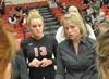 Kelly Elliott, head coach, talks to Caroline Robbins and the rest of the Lady Bulldog volleyball team during a timeout. - Photo by Morris Abernathy